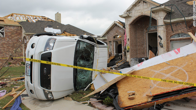 An estimated 13 tornadoes may have touched down in north Texas on Tuesday, the National Weather Service said. 