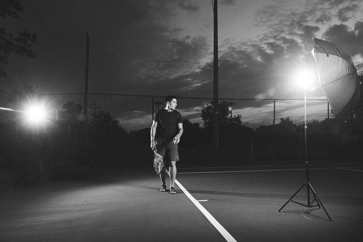 An example showing an off-camera flash cross lighting setup for a portrait of a tennis player.