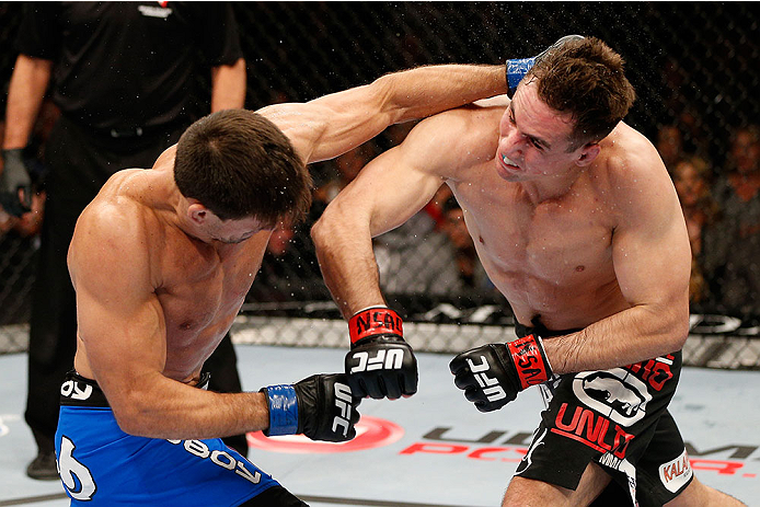LAS VEGAS, NV - FEBRUARY 22:  (R-L) Rory MacDonald punches Demian Maia in their welterweight bout during UFC 170 inside the Mandalay Bay Events Center on February 22, 2014 in Las Vegas, Nevada. (Photo by Josh Hedges/Zuffa LLC/Zuffa LLC via Getty Images) *** Local Caption *** Rory MacDonald; Demian Maia