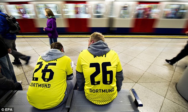 Waiting for the big match Two Dortmund fans in club shirts wait for a tube train to Wembley