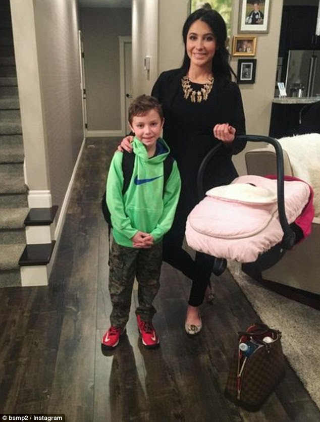 Family photo: Bristol shared this snapshot of herself posed with her son Tripp, seven, and her daughter Sailor Grace on Monday to commemorate her return to work one month after giving birth to her baby girl 