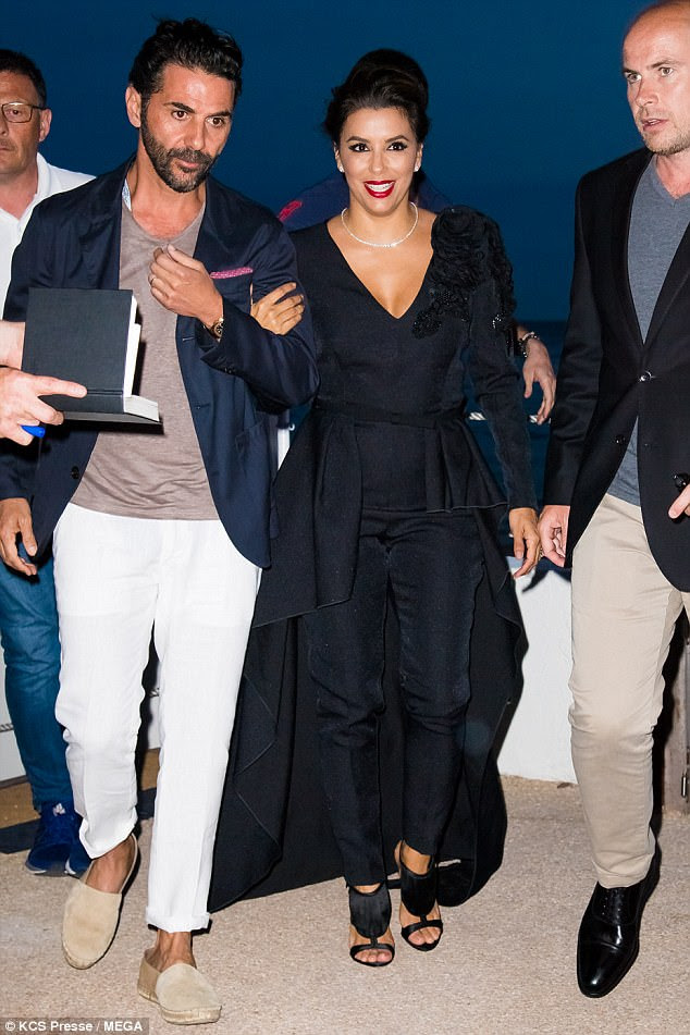 Her guy: Media mogul Jose wore a jacket in the same hue with cream chinos and a brown jumper