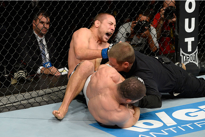 BARUERI, BRAZIL - OCTOBER 9:  (L-R) Mike Pierce screams while getting submitted by Rousimar Palhares in their welterweight bout during the UFC Fight Night event at the Ginasio Jose Correa on October 9, 2013 in Barueri, Sao Paulo, Brazil. (Photo by Jeff Bottari/Zuffa LLC/Zuffa LLC via Getty Images)