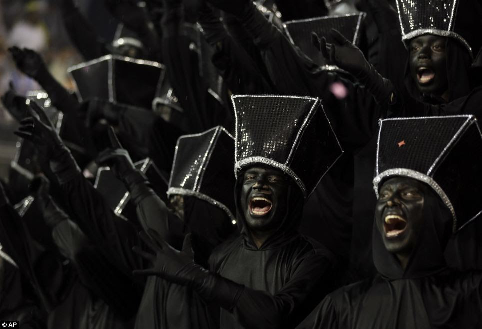 Singing: Sao Paulo is expected to draw in around 28,000 tourists to carnival this year, according to Ítalo Cardoso, Vice president of SPTB. Above, dancers in Sao Paulo