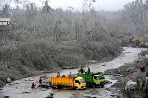 Villagers clear the ash clogging the Batang river following Mount Merapi's eruption near Dukun in central Java on November 11, 2010. Indonesia's most active volcano Mount Merapi was shooting clouds of ash high into the sky today after a series of major eruptions, and an alert status remains in force, an official said AFP PHOTO/ROSLAN RAHMAN (Photo credit should read ROSLAN RAHMAN/AFP/Getty Images)