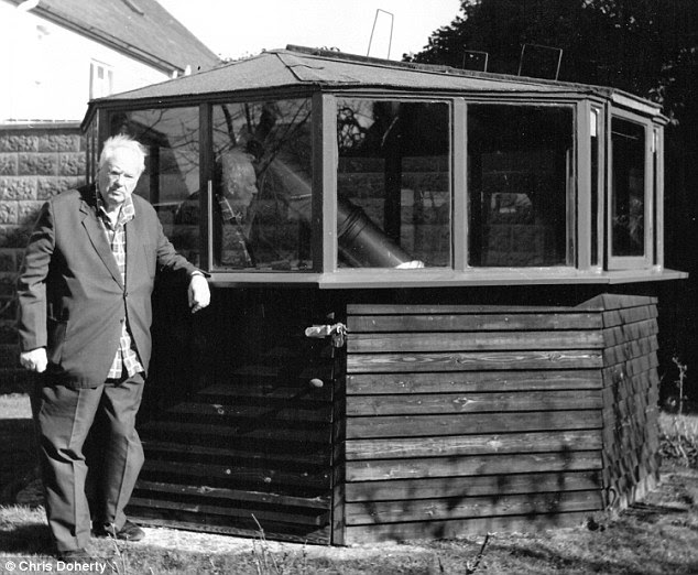 Sir Patrick Moore in 1995 standing outside his private observatory in his garden at Farthings in West Sussex