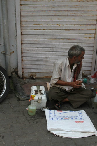 The Barber Waiting For a Girhak on Pitru Paksh by firoze shakir photographerno1
