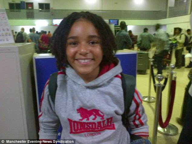 Arrival: A British school has banned nine-year-old Kofi Mason-Sesay, pictured arriving at Heathrow Airport from from Sierra Leone last week, because parents feared the boy could give his classmates Ebola