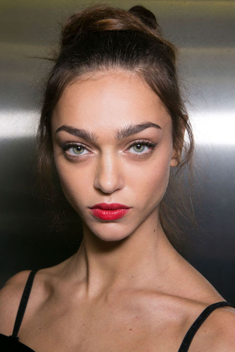 Red lipstick is classic, of course, but never have makeup artists been so united on the shade front as they were this season. The color to know: Snow White apple red—as true as it gets. The finish—satin, like at Dolce & Gabbana (left); patent lacquer, at Nina Ricci; or stay-in-place-all-night matte, at DKNY— is fair game, so long as the lipstick is applied with utter precision.
