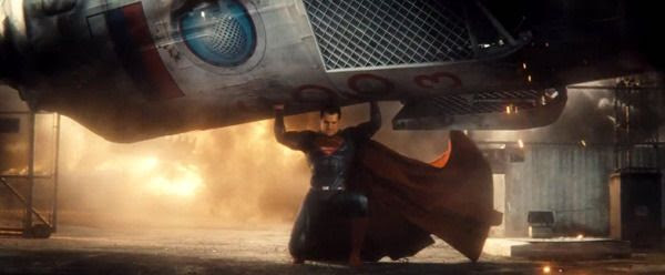 The Man of Steel carries a Russian rocket capsule to safety following a launch mishap in this scene from the BATMAN V SUPERMAN: DAWN OF JUSTICE Comic-Con trailer.