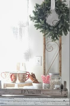 Farmhouse Christmas, fresh wreath, and a hot chocolate station in a French crate