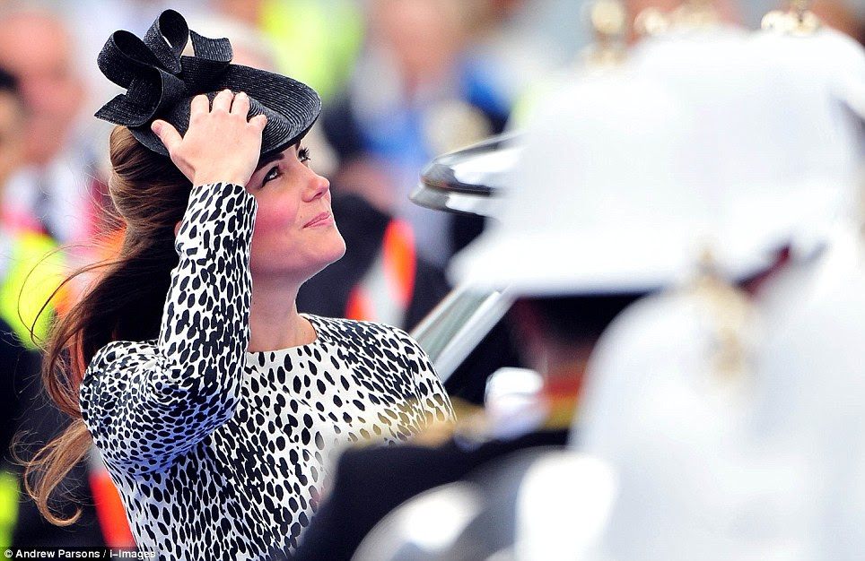 Happy: The Duchess looked in good spirits as she enjoyed a parade courtesy of the Band of Her Majesty¿s Royal Marines Portsmouth and The Pipe Band of 1st Battalion Irish Guards