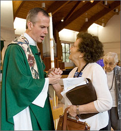 Pastor Gary Erdos says goodbye to Helen West after the last service at St. Mark on Oct. 22.