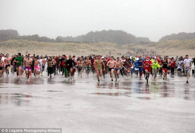 Hundreds of people in fancy dress also took a plunge at Pembrey Park, west Wales, for this year's Walrus Dip