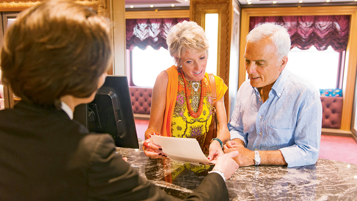 Aboard the MSC Divina, a couple chooses photos to buy. Usually there are four to seven studio locations on an MSC ship.