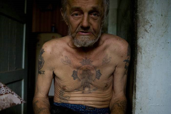 English Russia has a great photo collection of Russian prison tattoos: