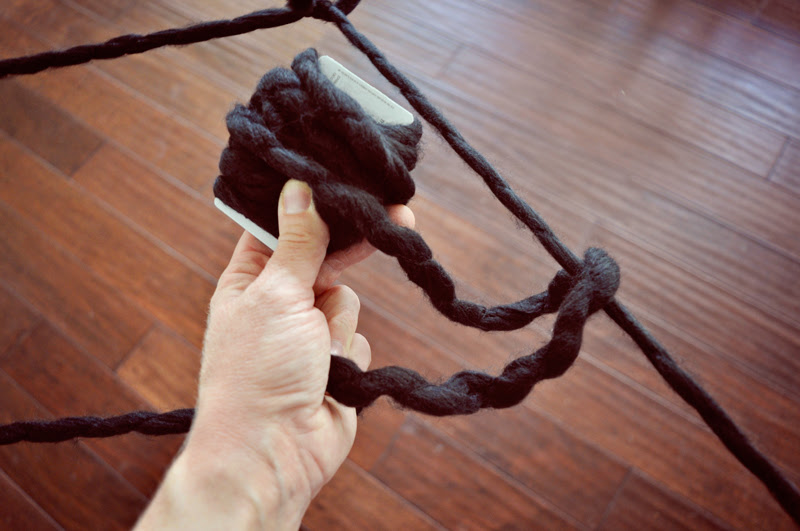 How to make an extra large spider web | Easy decor for a Halloween party: an oversized yarn spiderweb, so easy to make but such a big impact! | Simple Halloween Decor Ideas and Tutorials at Remodelaholic.com