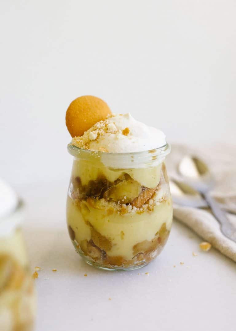 Caramelized Banana Pudding by Wood and Spoon blog. This is a traditional Southern style banana pudding dessert made with vanilla wafers, whipped cream, and caramelized bananas. The cinnamon-scented syrup of the bananas adds great flavors and makes for a fun alternative to banana pudding. Serve these in whole containers or miniature individual jars. Learn more about this summer dessert on thewoodandspoon.com