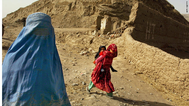 A file photograph of an Afghan woman in Kunduz province, where the Taliban stoned and man and a woman to death Sunday.