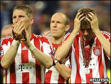 Bayern's Bastian Schweinsteiger and Thomas Muller show their  dismay