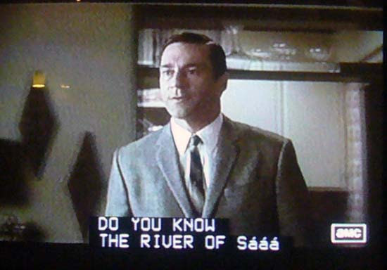 Man in suit with captions underneath stating DO YOU KNOW THE RIVER OF SHáá