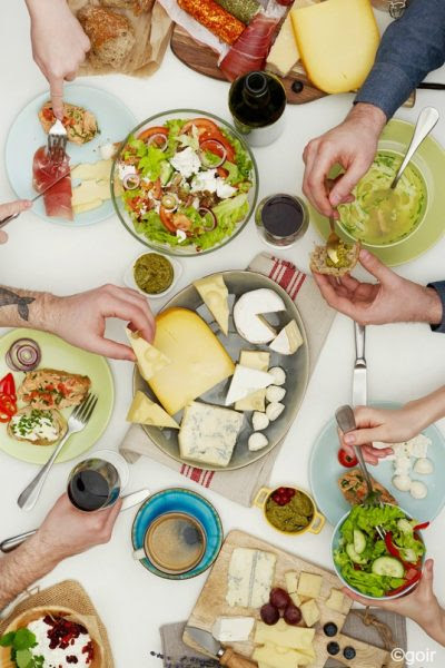 View from above the table of people eating. photo copyright Goir