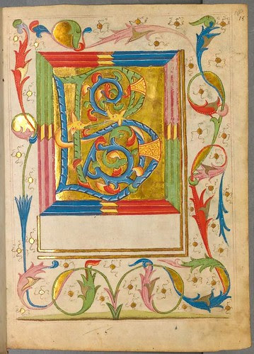 Large detailed illuminated letter and surrounding arabesque decoration