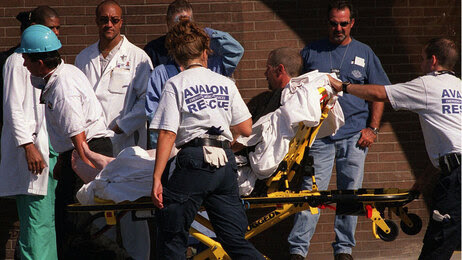 An injured firefighter is brought into the emergency room at St. Vincent's Hospital in Manhattan, Sept. 13, 2001.