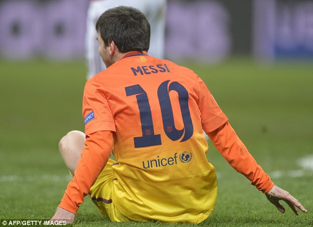 Rough and tumble: The best player in the world could not help his side as they stumbled to a 2-0 defeat
