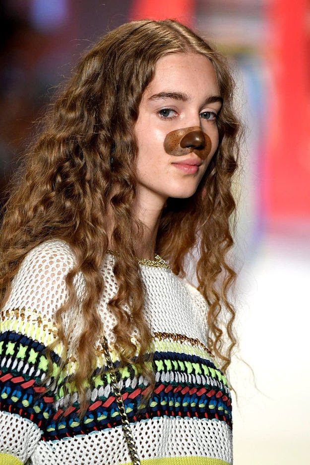 And upon closer inspection, I realized IT'S THE GODDAMN DOG FILTER ON SNAPCHAT.