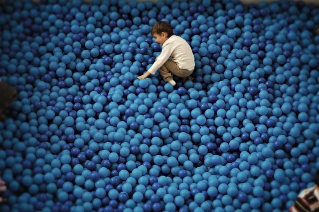 Boy in Blue: Kid Playing at L'Illa Diagonal - CLICK to Enlarge
