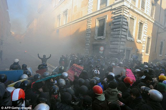 Youths rioted in the street, facing the police and demanding a change of government as parliament instead voted their confidence in scandal-plagued Berlusconi 