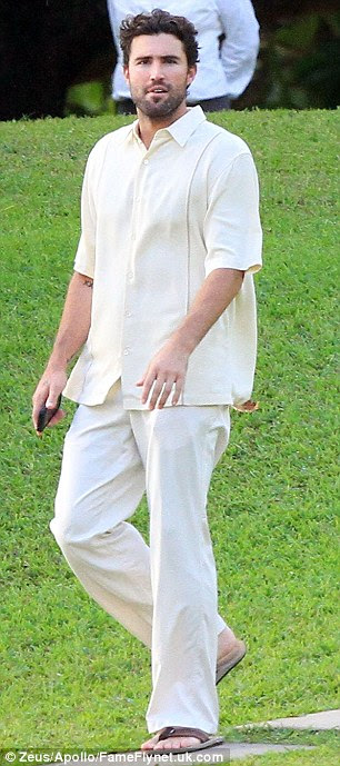 Family affair: Father of the groom Bruce Jenner with a friend and right, his son Brody 