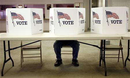 A voter casts a ballot at the Flushing Volunteer Fire Department in Flushing, Ohio, March 6, 2012. REUTERS/Matt Sullivan