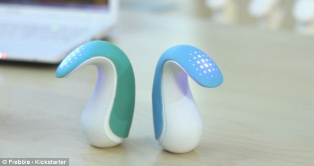 Frebbles (pictured) are ergonomically designed and simulate the touch of holding and squeezing another person's hand - and having that feeling reciprocated. When a Frebble is squeezed by one person, the corresponding gadget will gently apply pressure to the back ofa partner's hand, to simulate holding hands