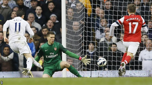 Tottenham forward Gareth Bale (left) scores against Arsenal