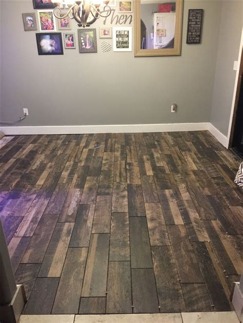 Flooring goes a long way toward defining the look of a room. Marazzi Montagna weathered brown wood look tile. Random