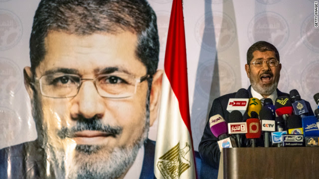 The Muslim Brotherhood on Sunday claims that its candidate, Mohamed Morsi, has defeated foe Ahmed Shafik to become Egypt's president. A count by state media shows Morsi ahead, but with millions of votes still to be counted.