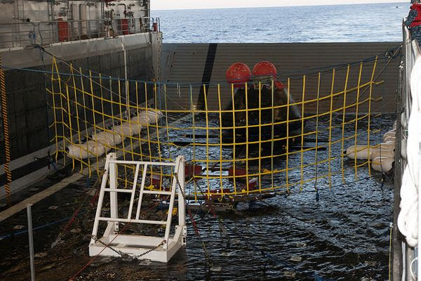 The Orion EFT-1 spacecraft is secured inside the well deck of the USS Anchorage hours after the capsule safely splashed down in the Pacific Ocean, on December 5, 2014.