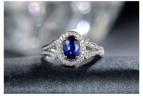 14,850 pesos only.50 carats si clarity size 7 . Vintage 2 Carat Blue Sapphire and Diamond Halo Engagement