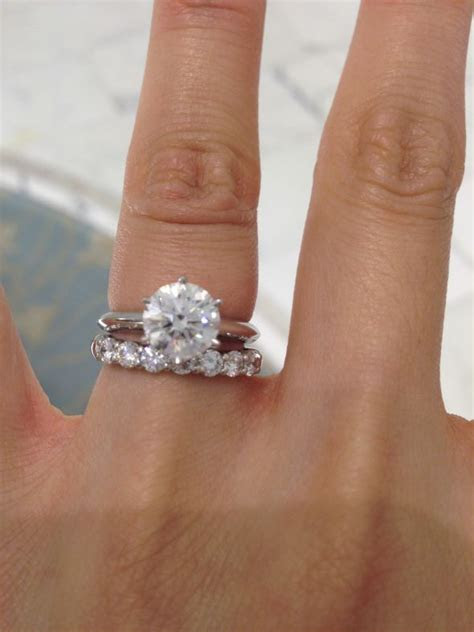 And a cartier love bracelet as well as her engagement ring and wedding band and studs from birks as she is interviewed by oprah. Help with choosing Wedding Band with Solitaire Ring (Photo