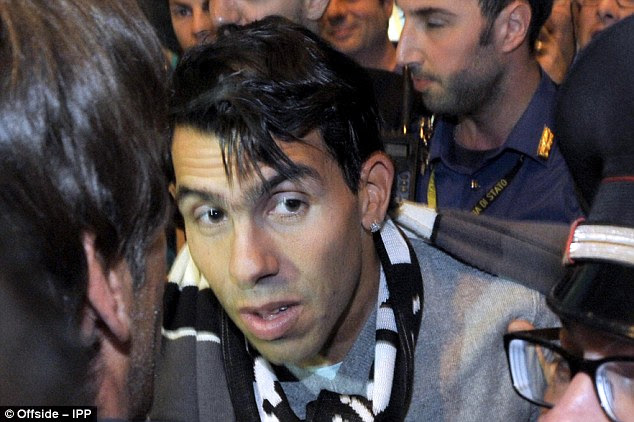 Shaken: Tevez did look slightly taken aback with all the attention