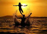 Sun sea and people playing