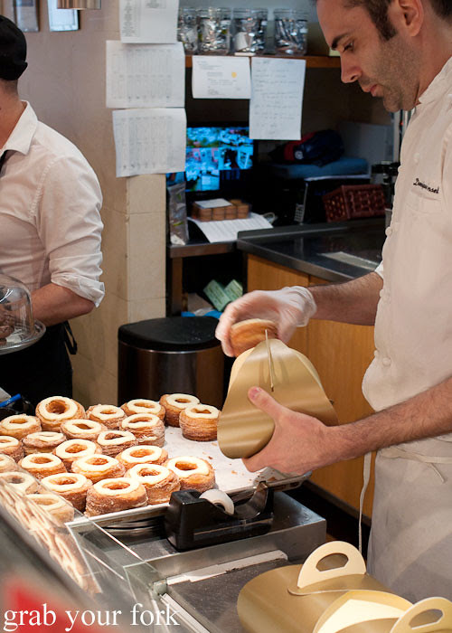 packing cronuts into carry boxes at dominique ansel bakery nyc new york