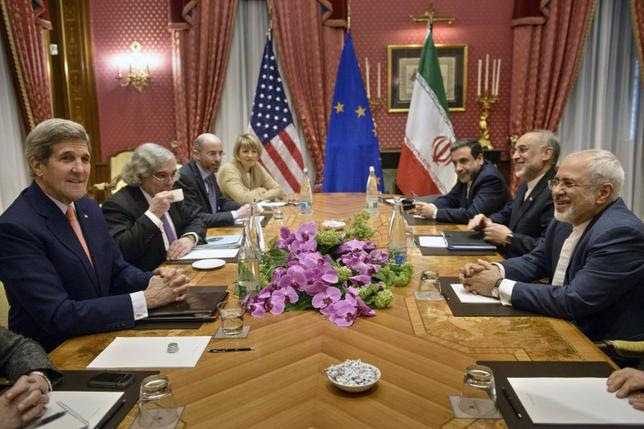 U.S. Secretary of State John Kerry (L), U.S. Secretary of Energy Ernest Moniz (2nd L), the head of the Iranian Atomic Energy Organization Ali Akbar Salehi (2nd R) and Iranian Foreign Minister Javad Zarif (R) wait with others for a meeting at the Beau Rivage Palace Hotel March 28, 2015, in Lausanne. REUTERS/Brendan Smialowski/Pool