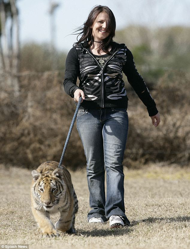Felicia, who is homeschooled, has fed, walked and cared for the   cub since he was born as his mother, a first-time mum, didn't know what   to do