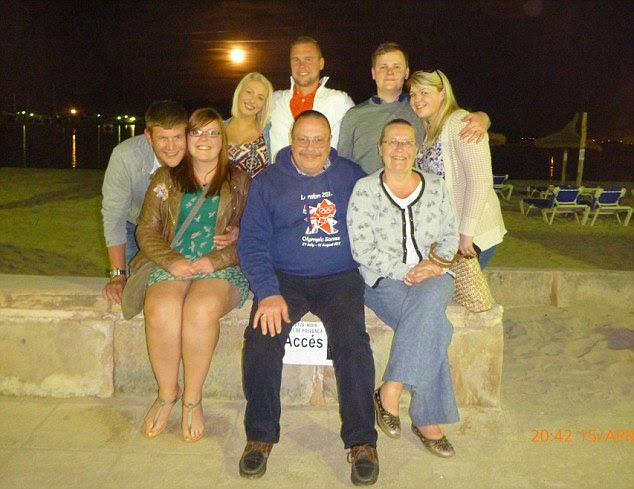 Family break: Mr and Mrs Beasant, bottom right, were holidaying with friends and family in Mallorca