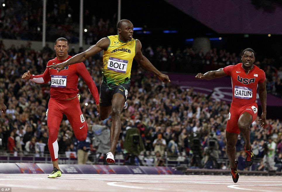 Strides ahead: Bolt, centre, upheld his title in the 100m dash this afternoon