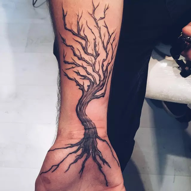 tree tattoo on bicep