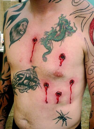 A lovely bullet hole tattoo. Death by Natural Causes